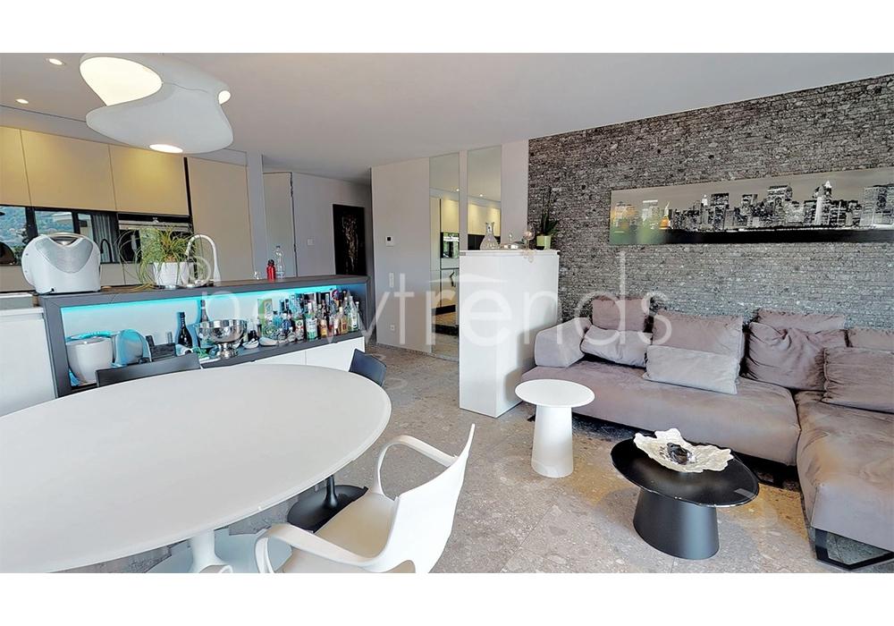 appartamento moderno vista lago a massagno: foto soggiorno luminoso con cucina open space