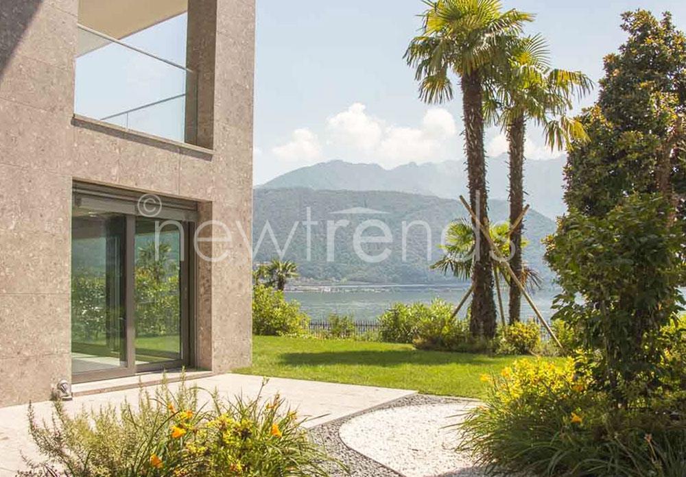nuovo e moderno appartamento con giardino vista lago a melide: foto render vista da giardino