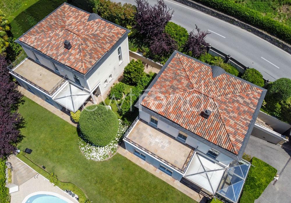 vendesi due eleganti ville gemelle ma indipendenti con piscina a davesco-soragno: foto vista aerea drone