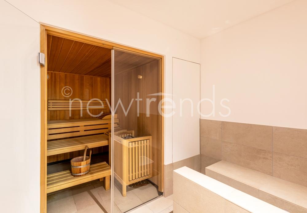 vendesi moderno appartamento minergie con piscina e zona wellness a figino: foto sauna condominiale